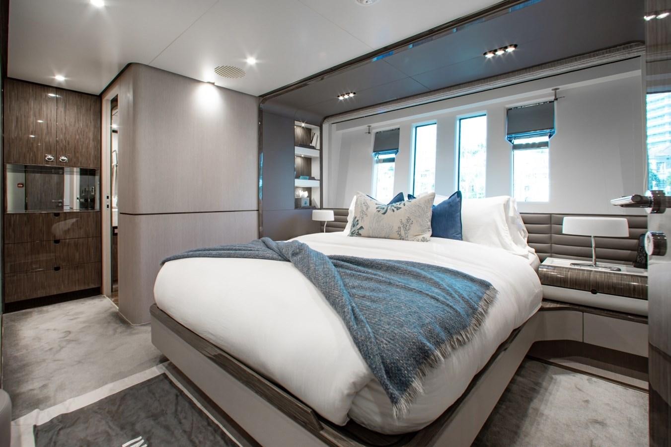 a bedroom with two beds aboard INDIGO Yacht for Sale