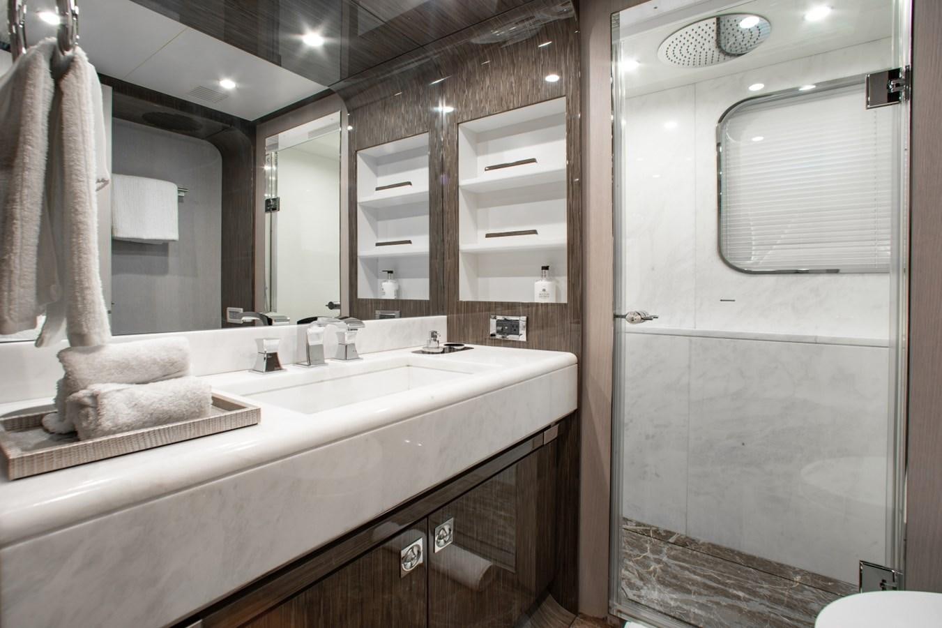a bathroom with a large mirror aboard INDIGO Yacht for Sale