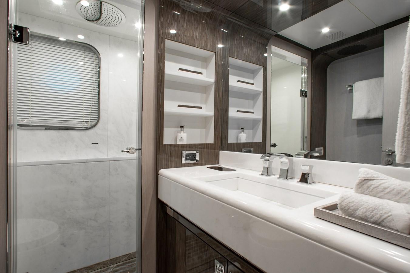 a bathroom with a large mirror aboard INDIGO Yacht for Sale