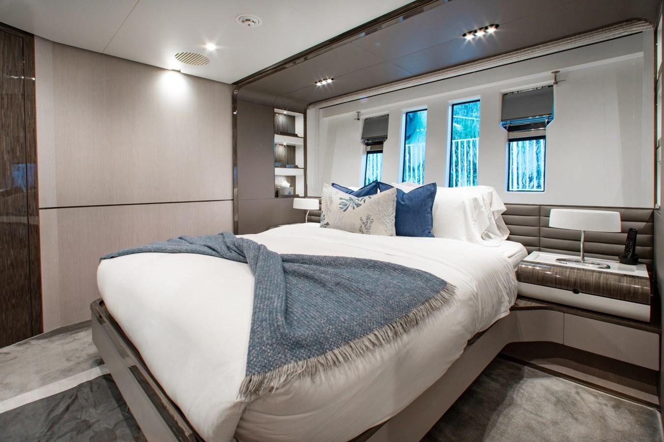 a room with two beds aboard INDIGO Yacht for Sale
