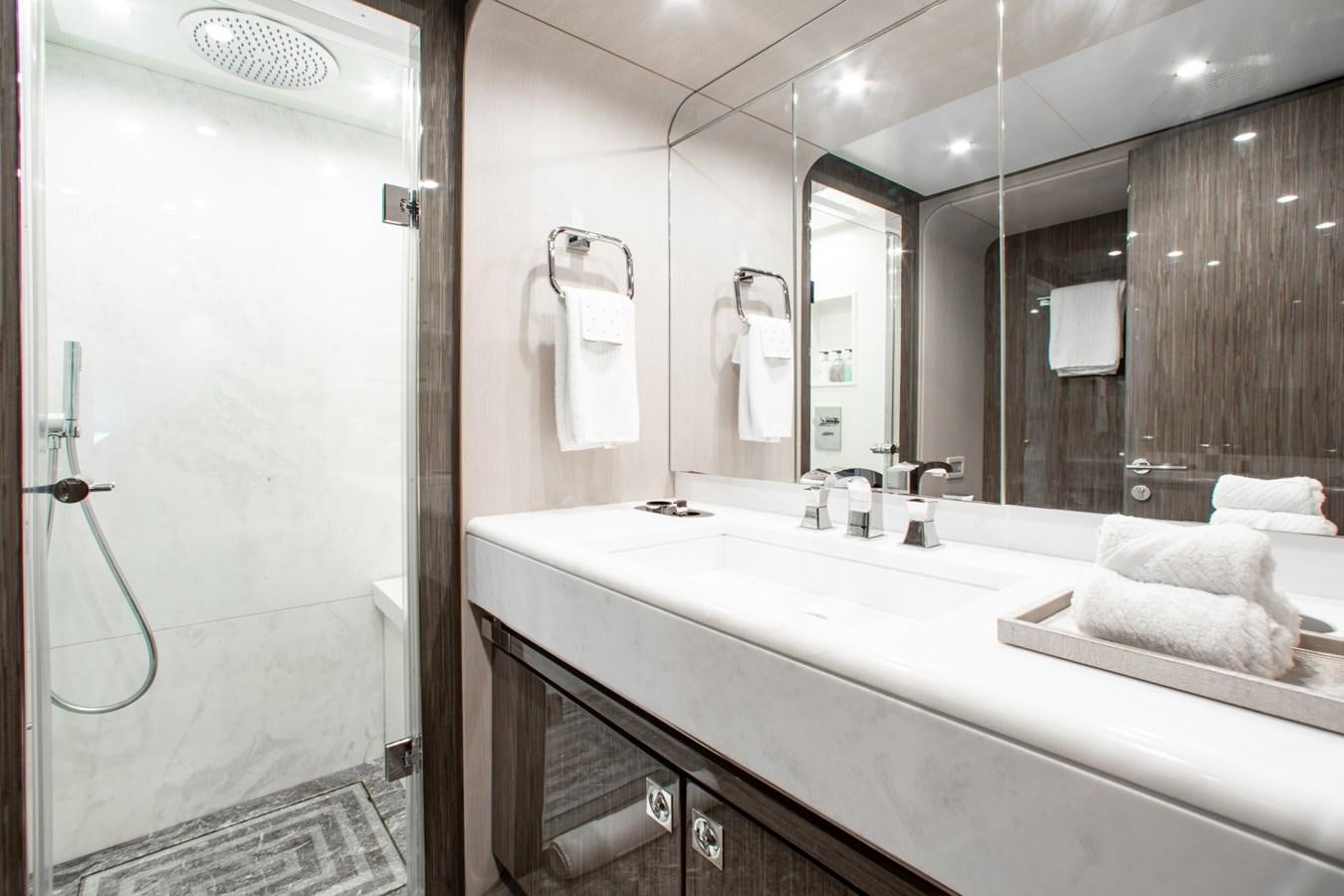 a bathroom with a large mirror aboard INDIGO Yacht for Sale