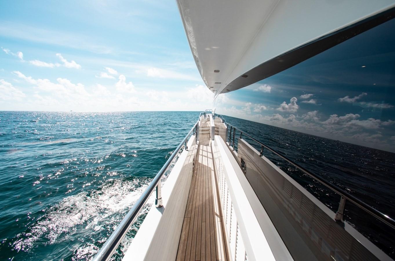 a long wooden bridge over water aboard INDIGO Yacht for Sale
