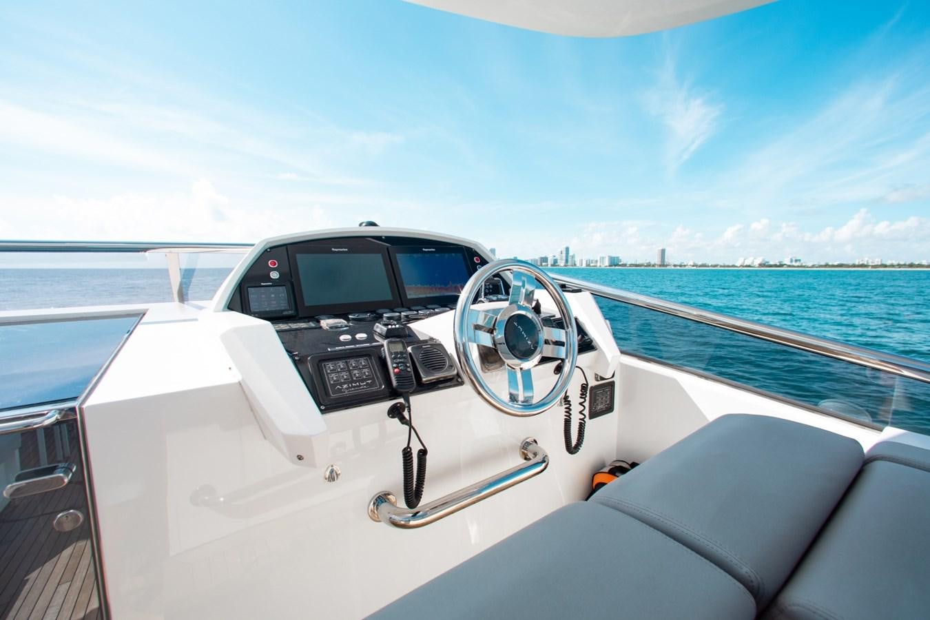a car driving on a boat aboard INDIGO Yacht for Sale