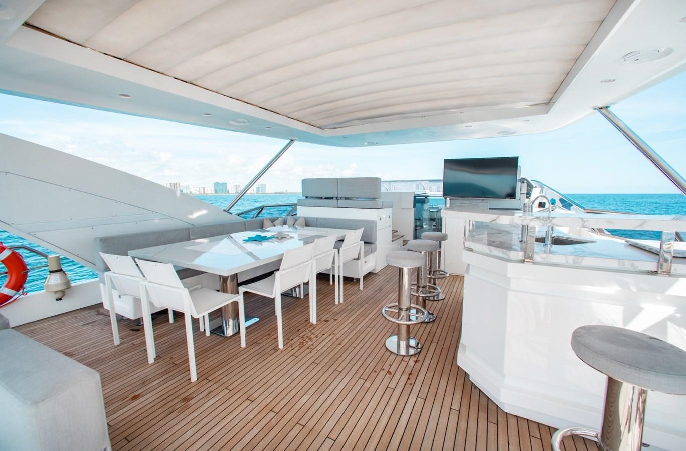 a room with a table and chairs aboard INDIGO Yacht for Sale
