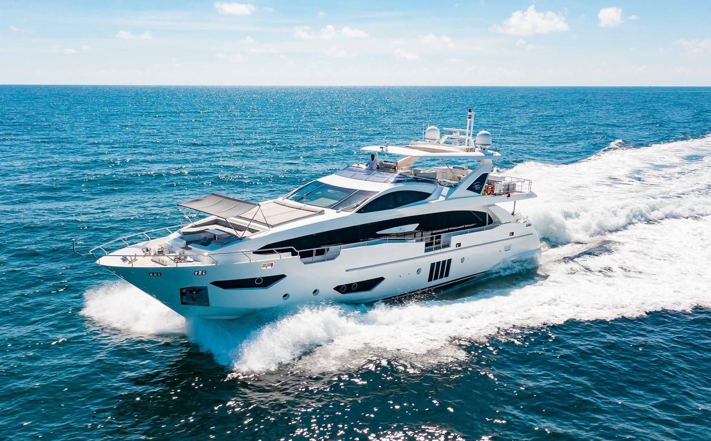 a white yacht on the water aboard INDIGO Yacht for Sale