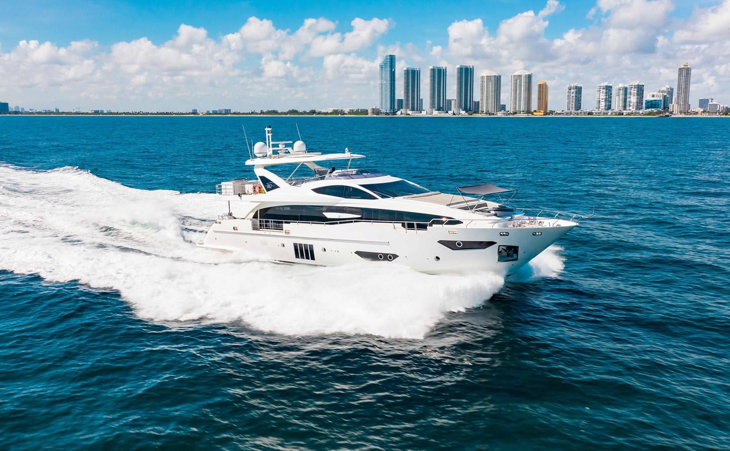 a white yacht on the water aboard INDIGO Yacht for Sale