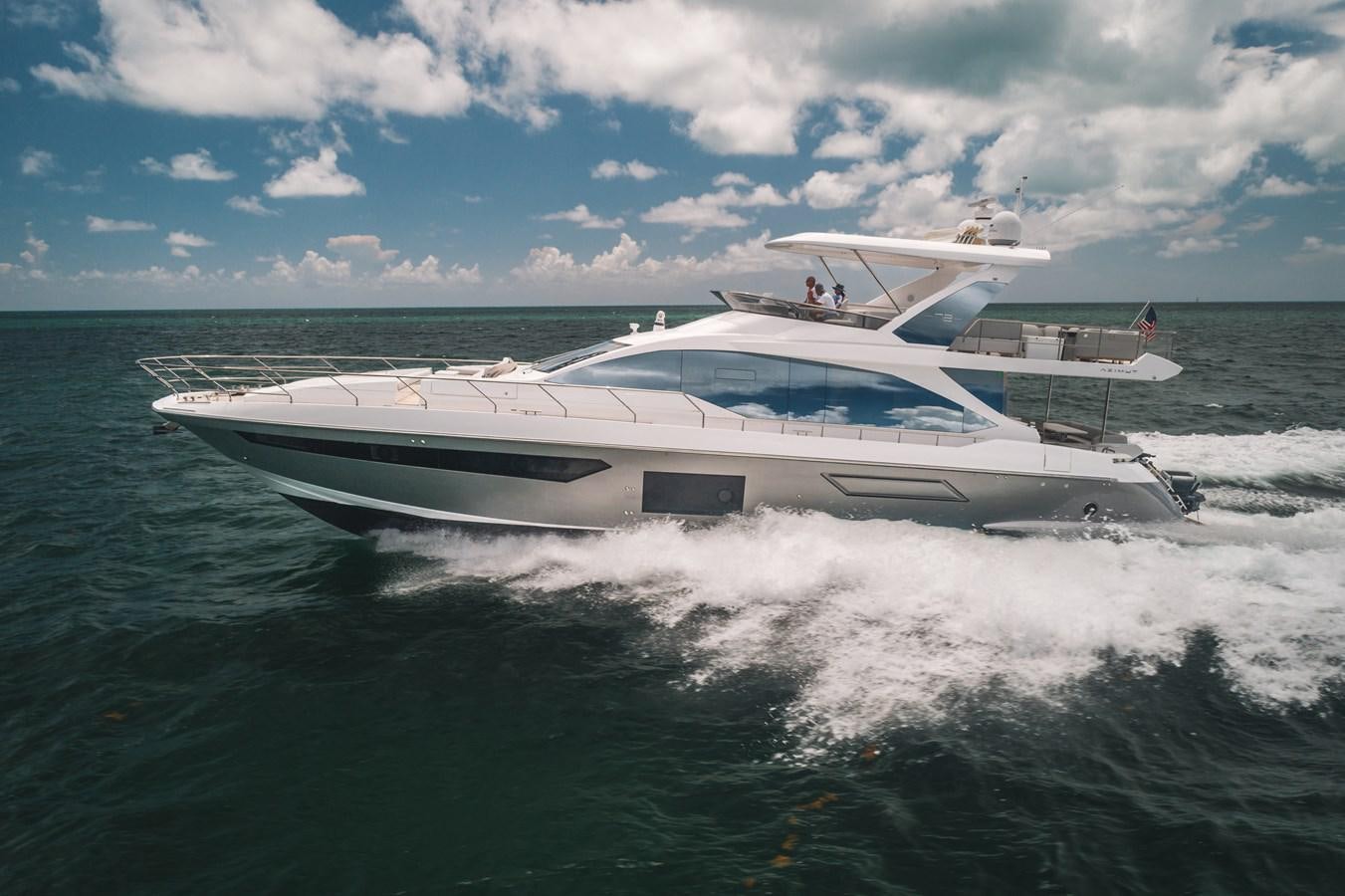 a boat on the water aboard 2022 AZIMUT 72 FLYBRIDGE OUR TRADE Yacht for Sale