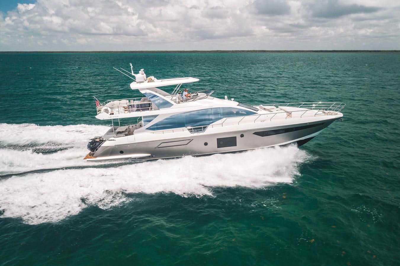 a boat on the water aboard 2022 AZIMUT 72 FLYBRIDGE OUR TRADE Yacht for Sale