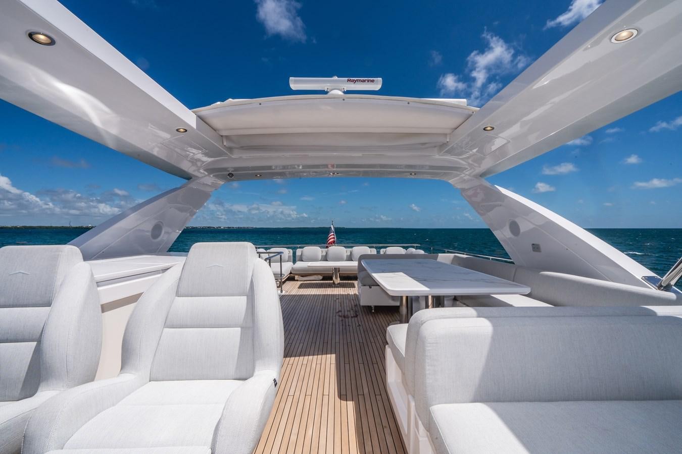a boat on the water aboard 2022 AZIMUT 72 FLYBRIDGE OUR TRADE Yacht for Sale