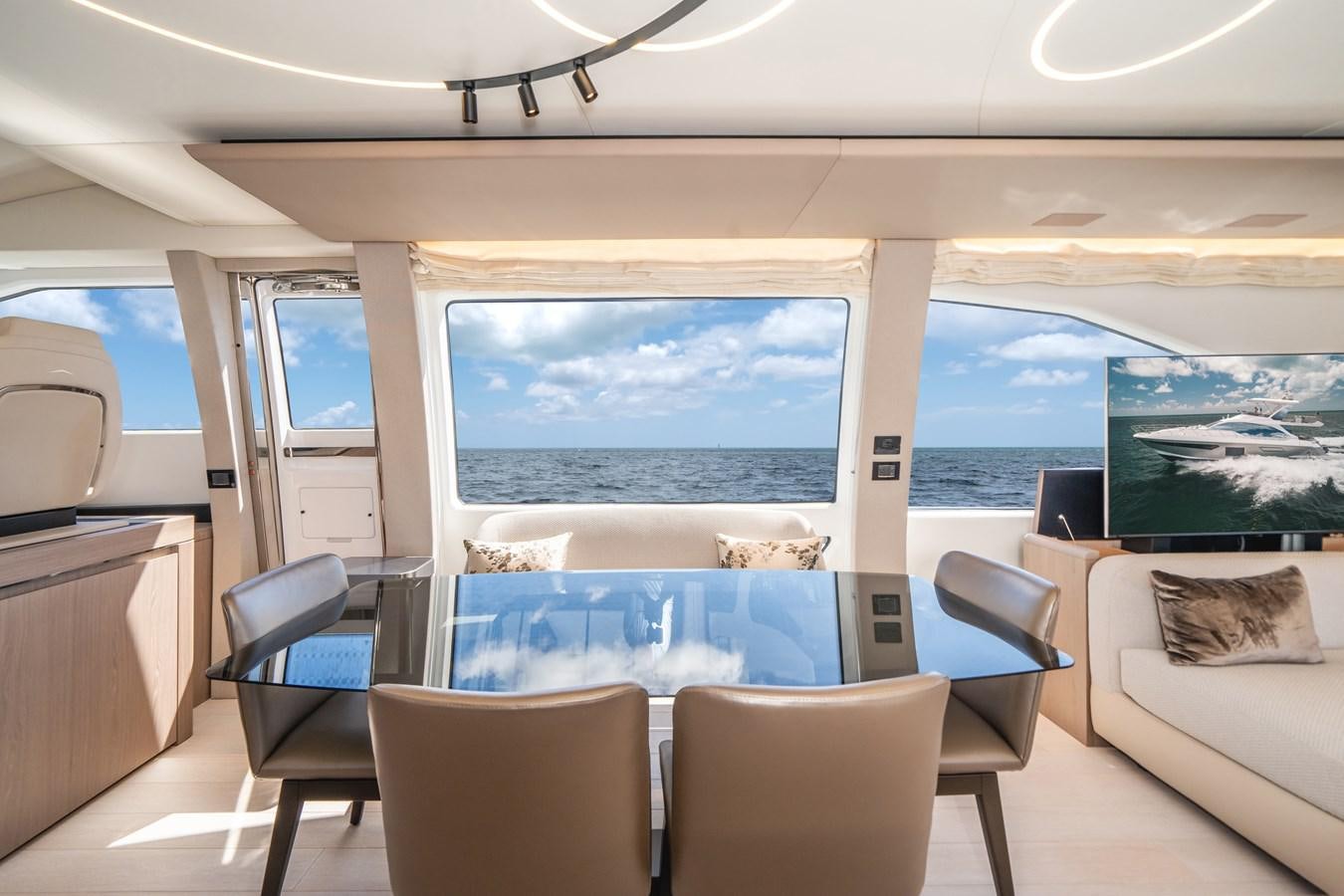 a room with a view of the ocean and the ocean aboard 2022 AZIMUT 72 FLYBRIDGE OUR TRADE Yacht for Sale