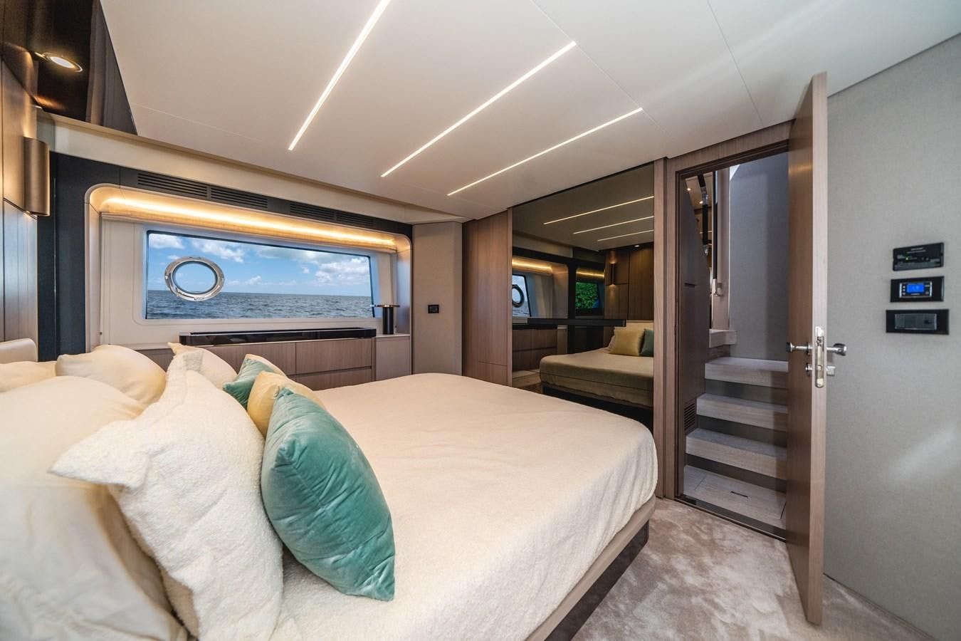 a bed in a room aboard 2022 AZIMUT 72 FLYBRIDGE OUR TRADE Yacht for Sale