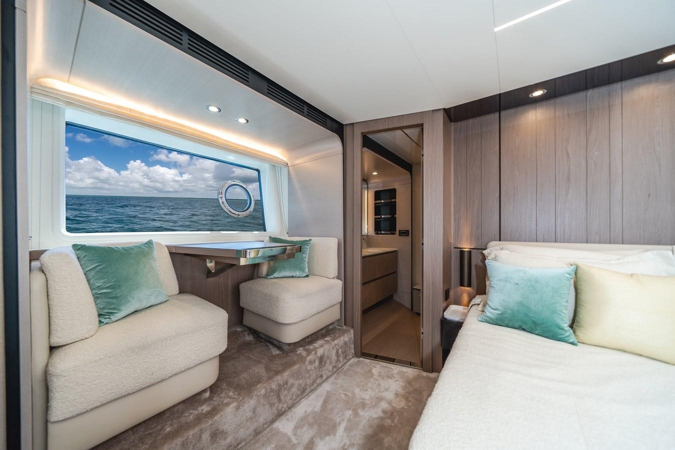 a room with a bed and a view of the ocean aboard 2022 AZIMUT 72 FLYBRIDGE OUR TRADE Yacht for Sale