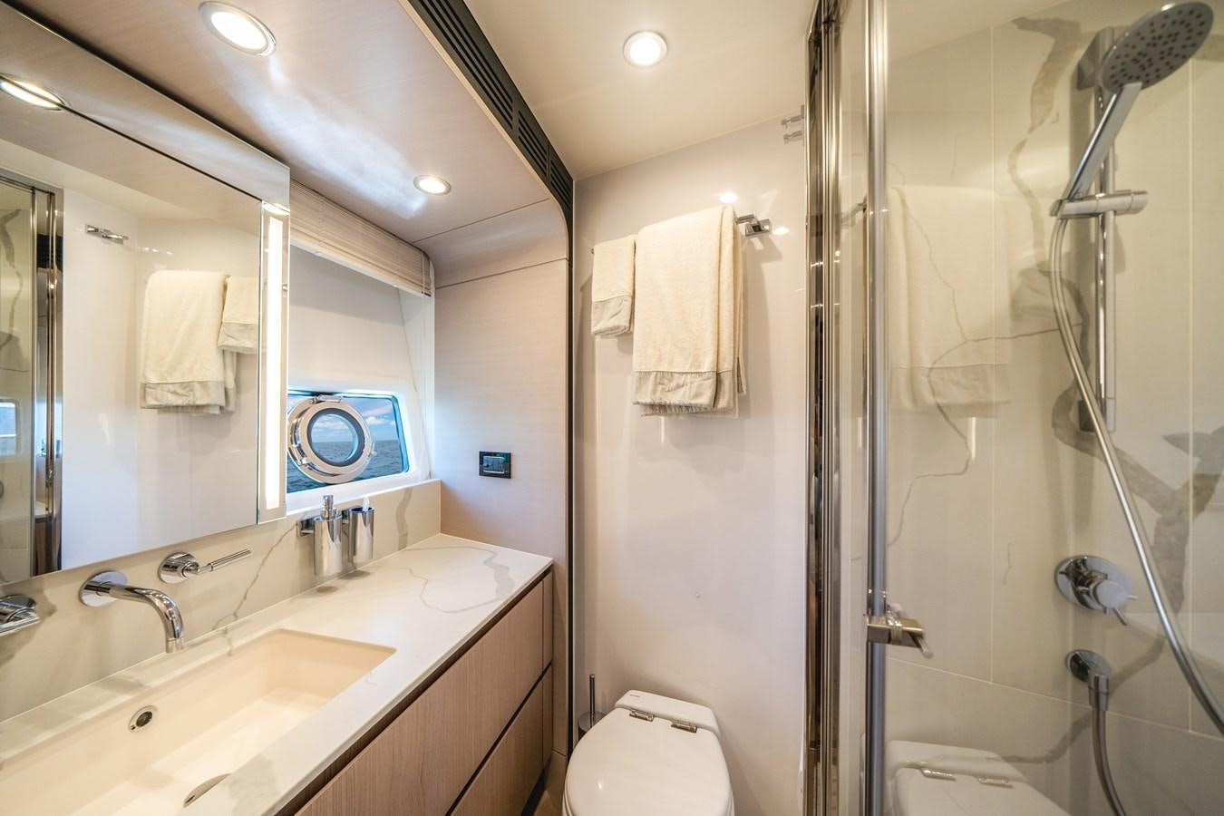 a bathroom with a shower and sink aboard 2022 AZIMUT 72 FLYBRIDGE OUR TRADE Yacht for Sale