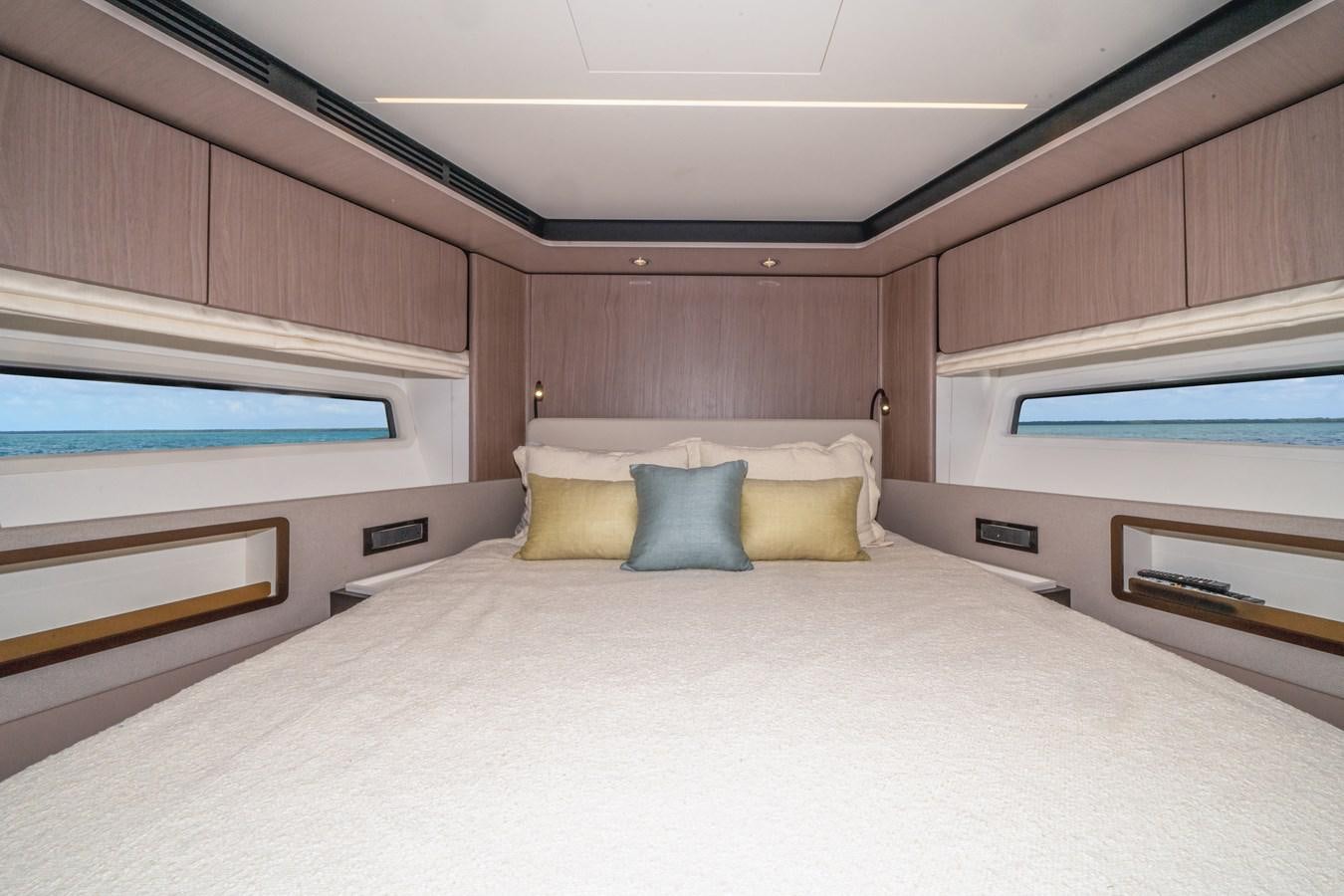 a bed with pillows aboard 2022 AZIMUT 72 FLYBRIDGE OUR TRADE Yacht for Sale