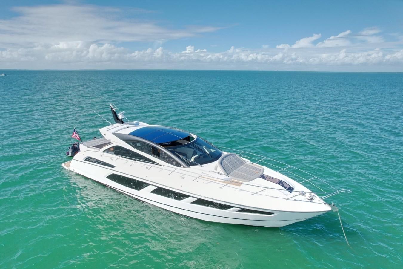 a white boat in the water aboard JOLLY ROGERS Yacht for Sale
