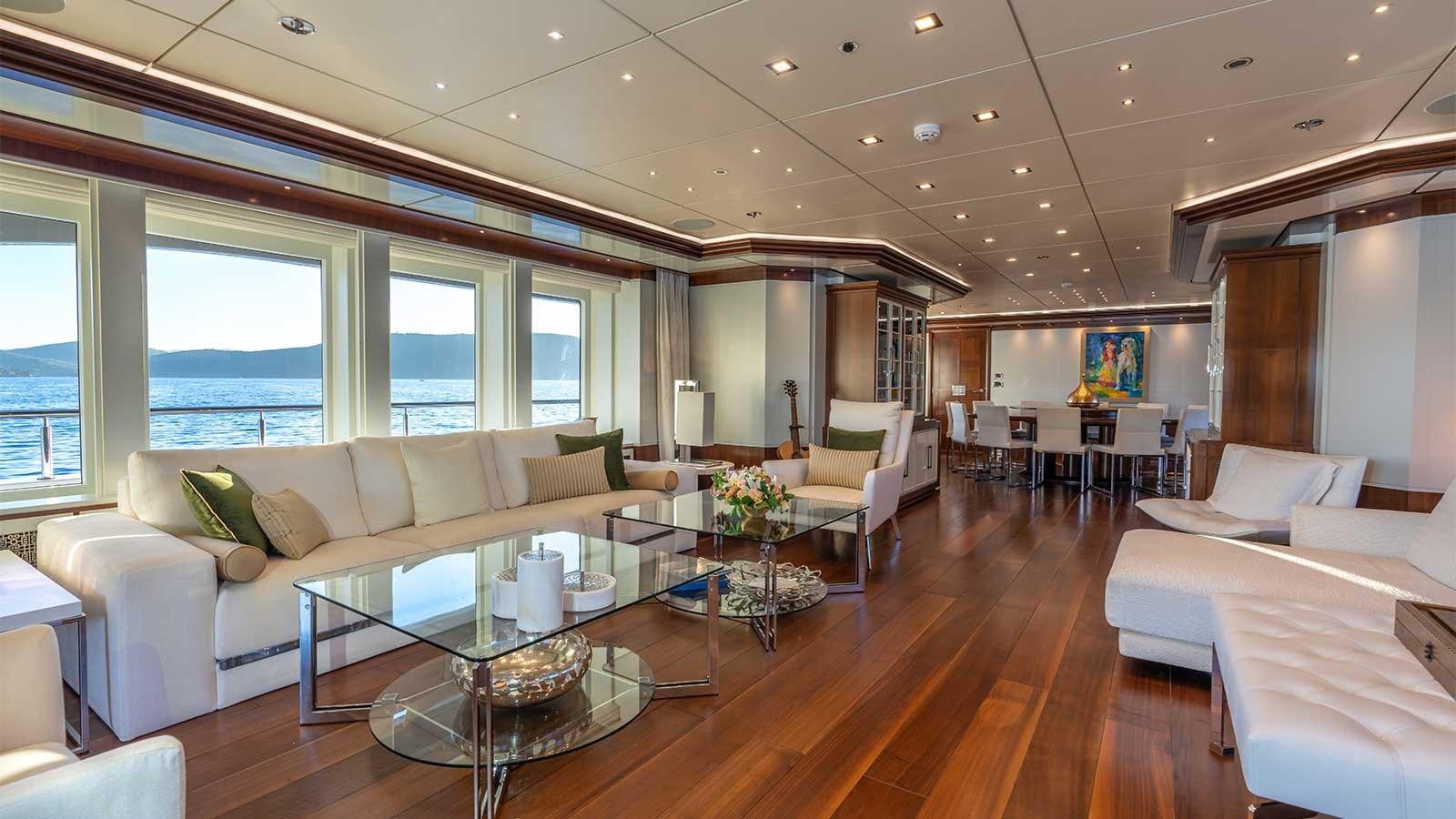 a living room with a large window aboard IMMERSIVE Yacht for Sale