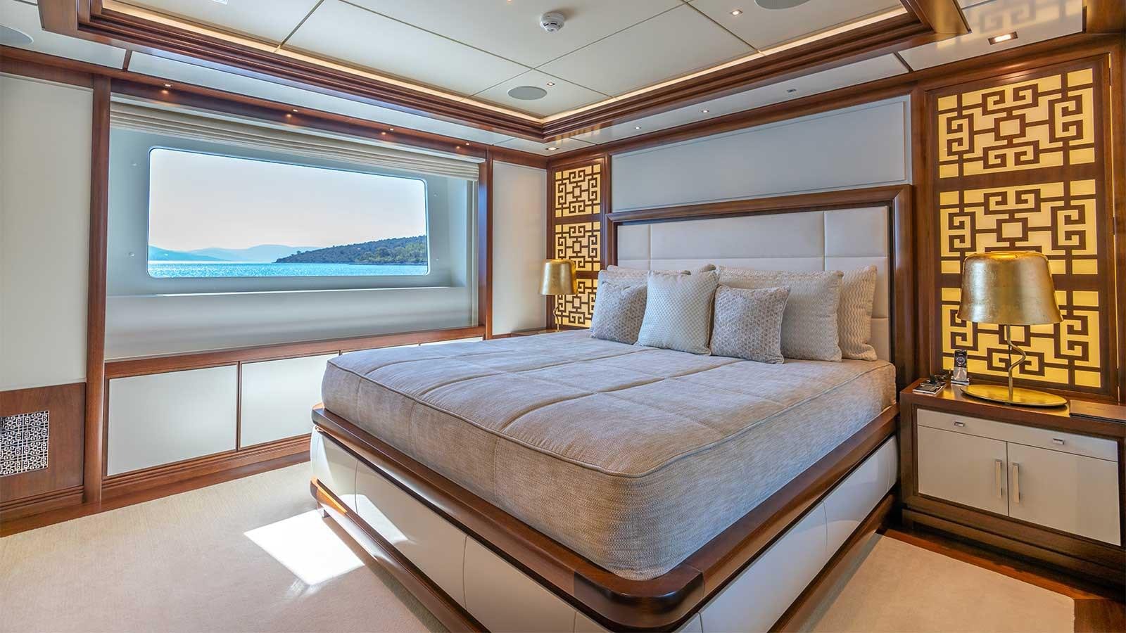 a bed in a room aboard IMMERSIVE Yacht for Sale