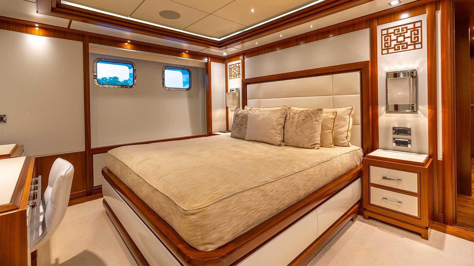 a bed in a room aboard IMMERSIVE Yacht for Sale