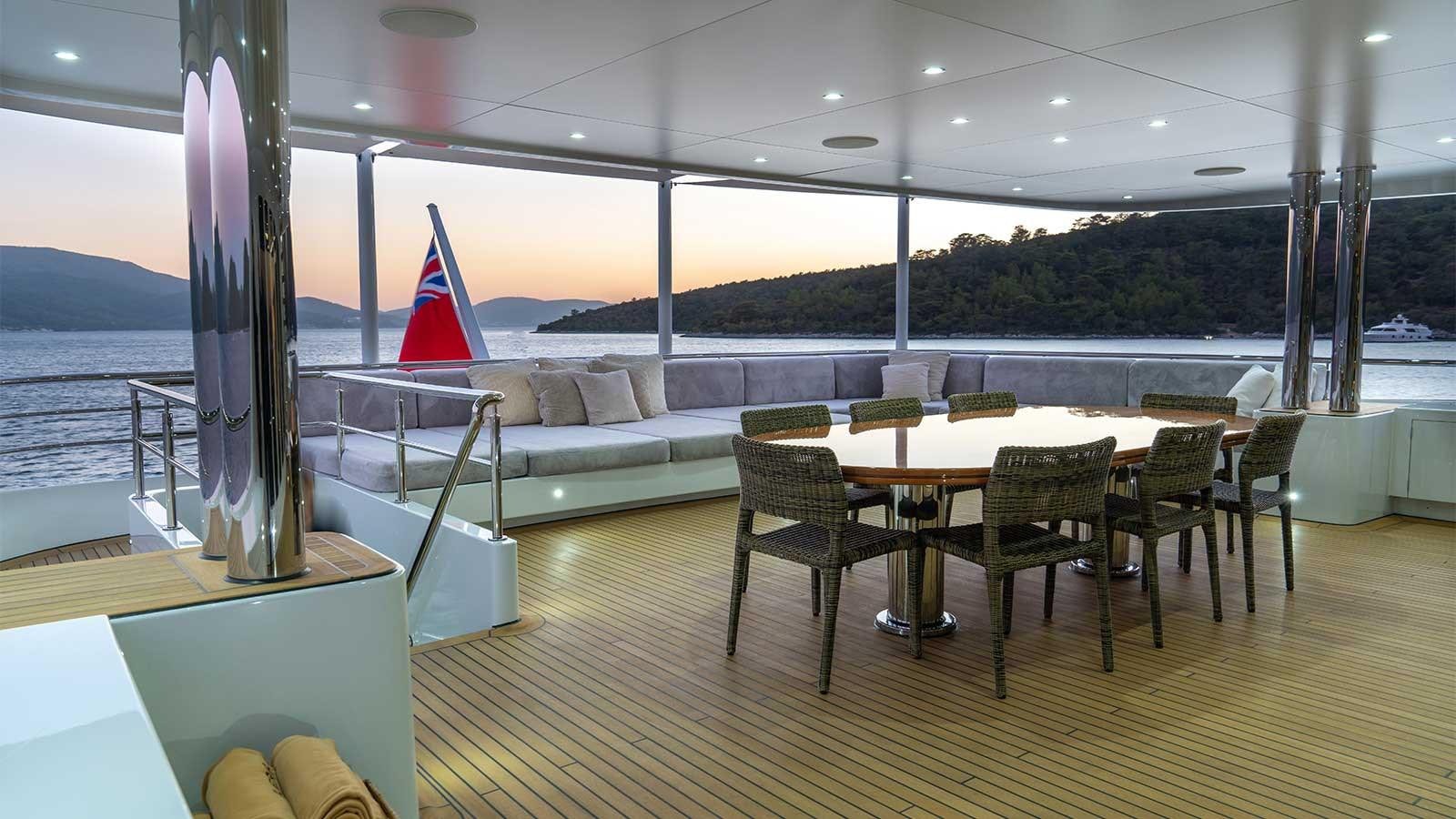 a room with a table and chairs aboard IMMERSIVE Yacht for Sale