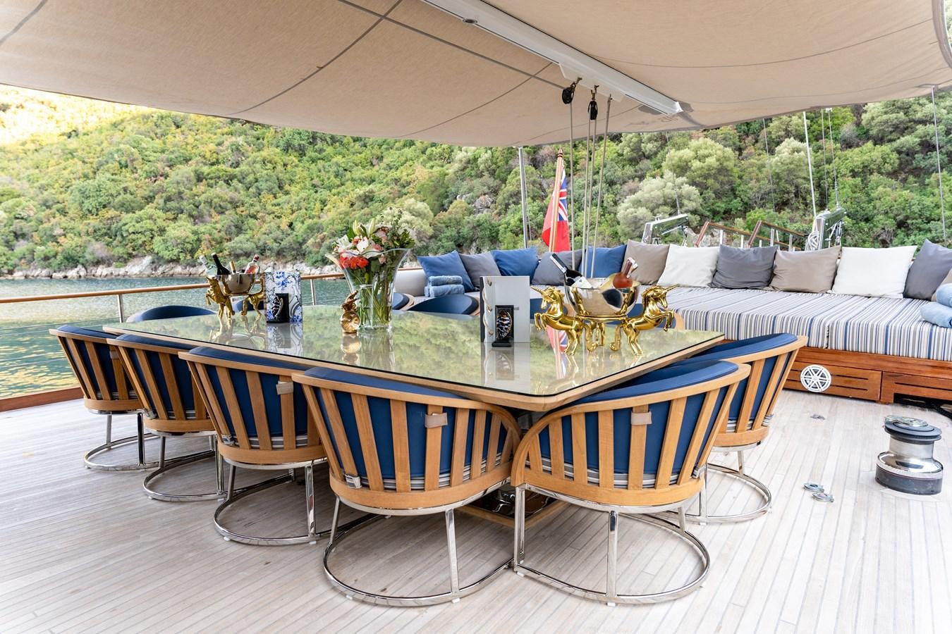 a table with chairs around it aboard EMANUEL Yacht for Sale