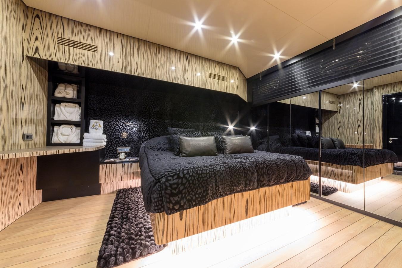 a room with a couch and a table aboard EMANUEL Yacht for Sale