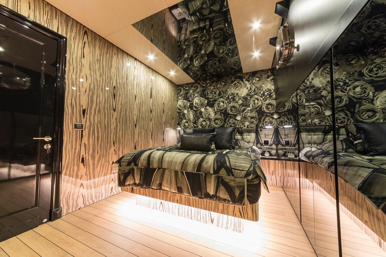 a room with a bed and a couch aboard EMANUEL Yacht for Sale