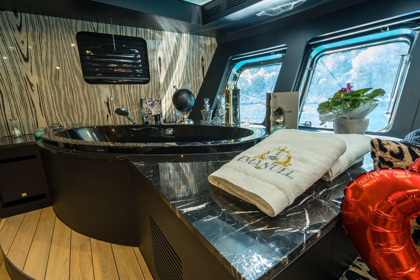 a kitchen with a large window aboard EMANUEL Yacht for Sale