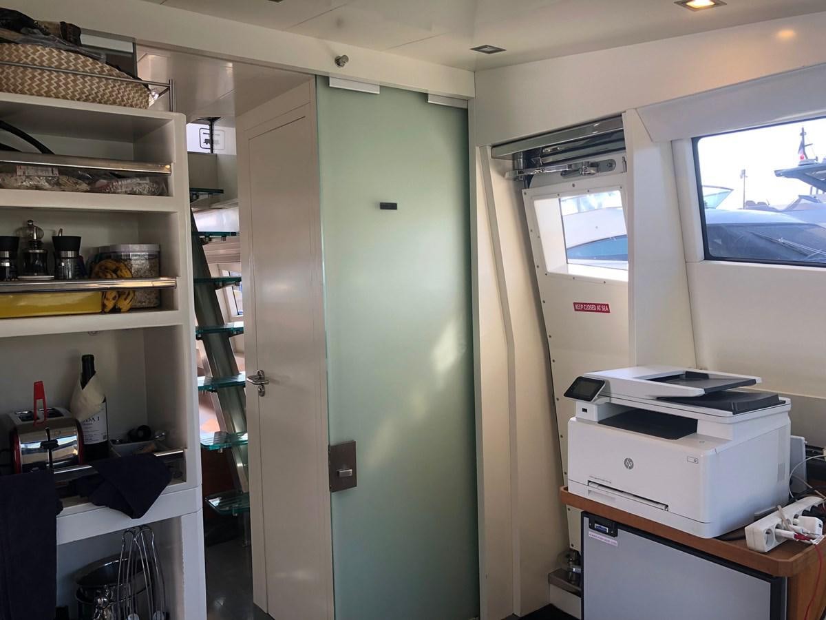 a room with shelves and a printer aboard OCEAN DELTA 11 Yacht for Sale