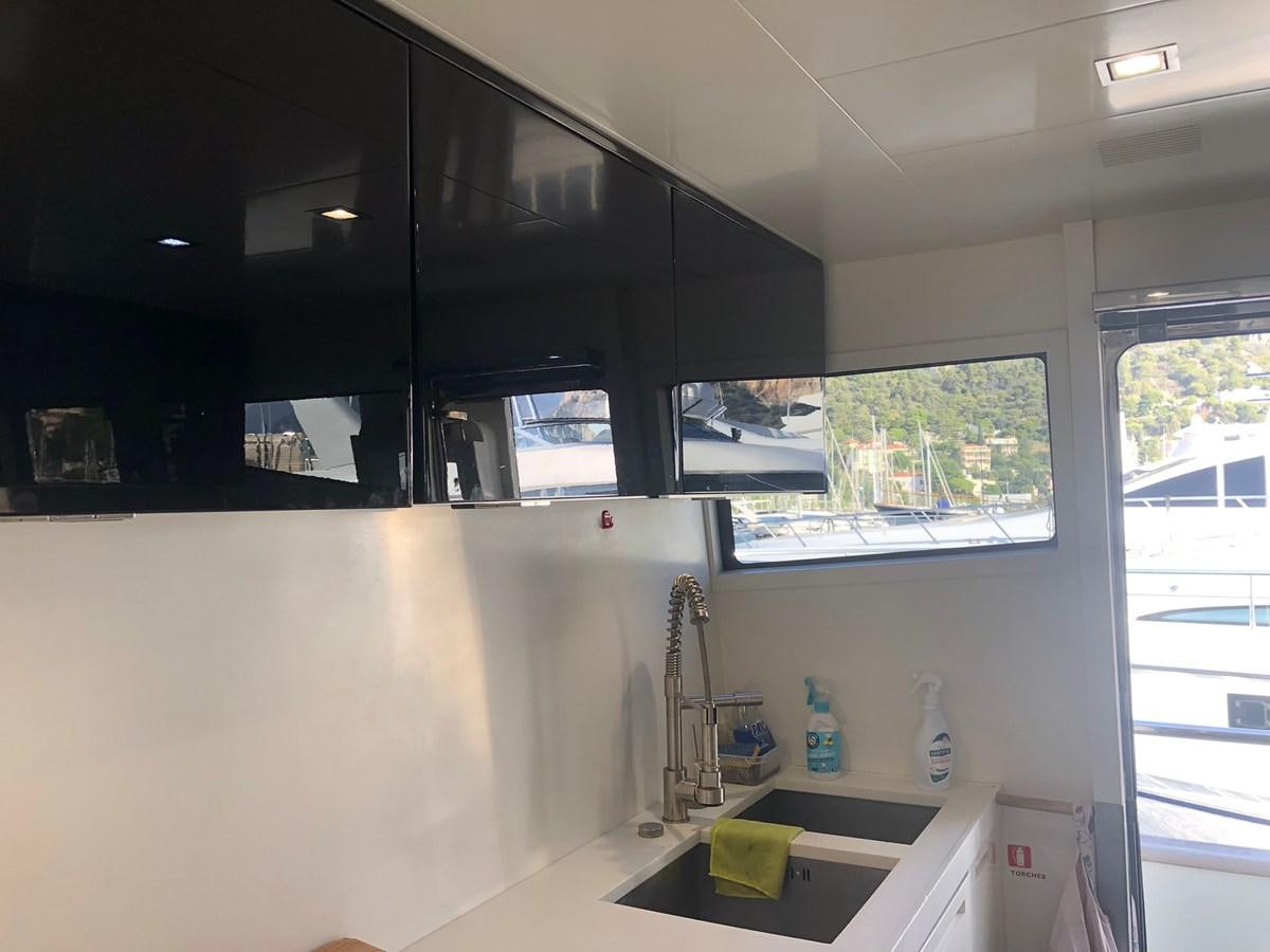 a kitchen with a window aboard OCEAN DELTA 11 Yacht for Sale