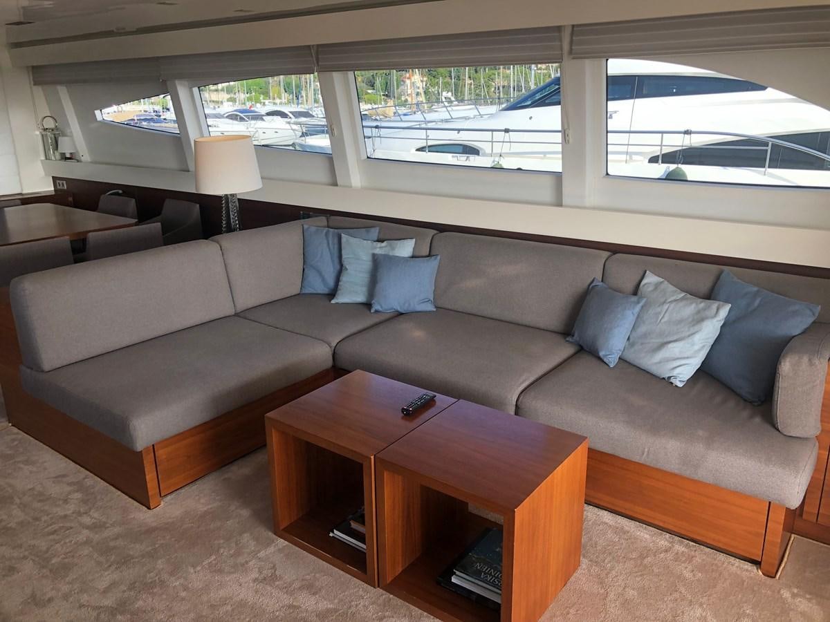 a couch with a coffee table aboard OCEAN DELTA 11 Yacht for Sale