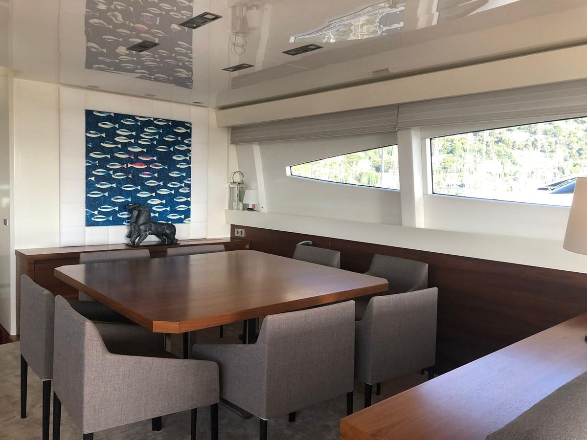 a room with a table and chairs aboard OCEAN DELTA 11 Yacht for Sale