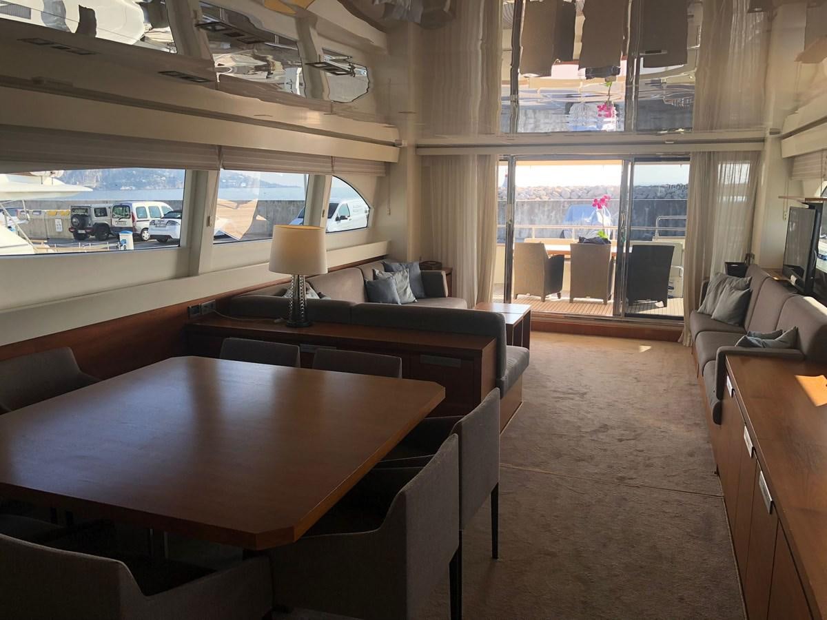 a room with a table and chairs aboard OCEAN DELTA 11 Yacht for Sale