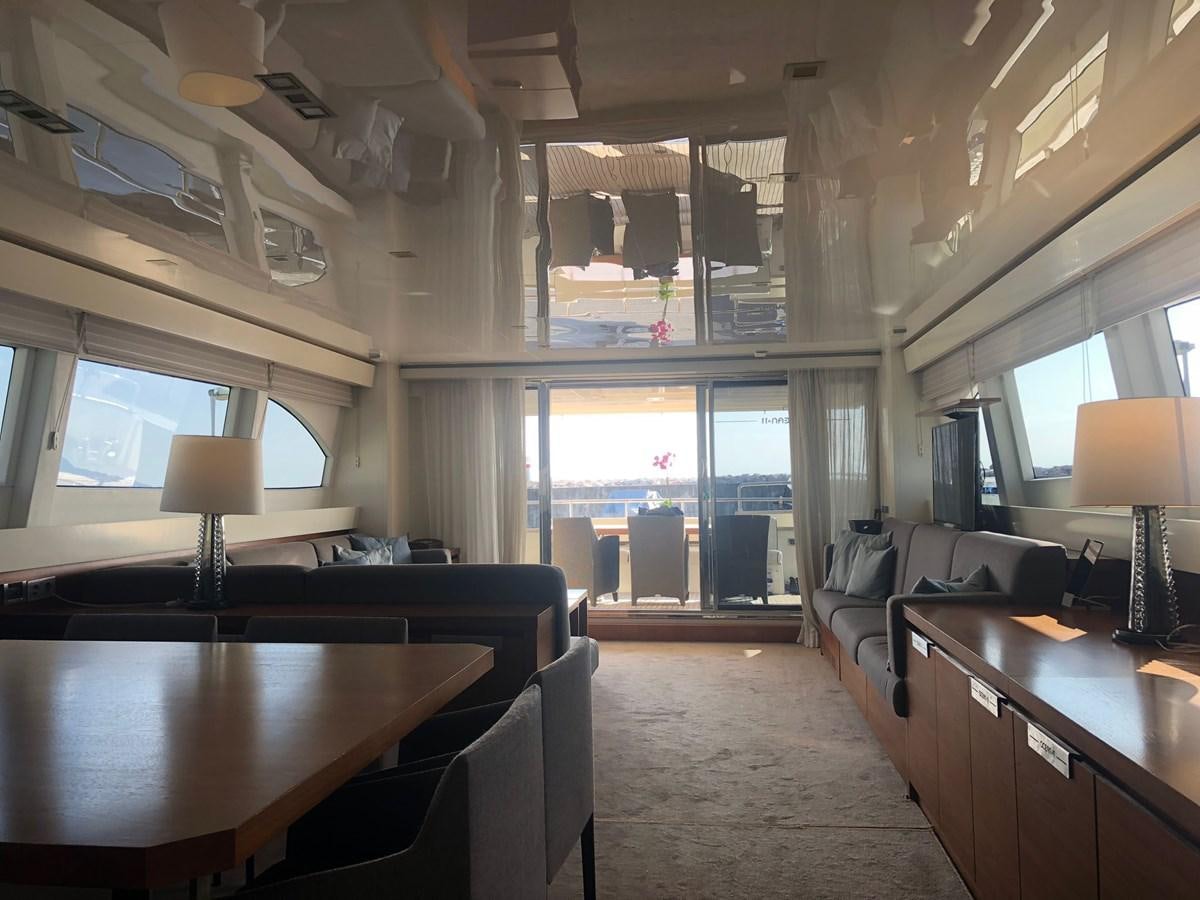 a room with a couch and a desk aboard OCEAN DELTA 11 Yacht for Sale