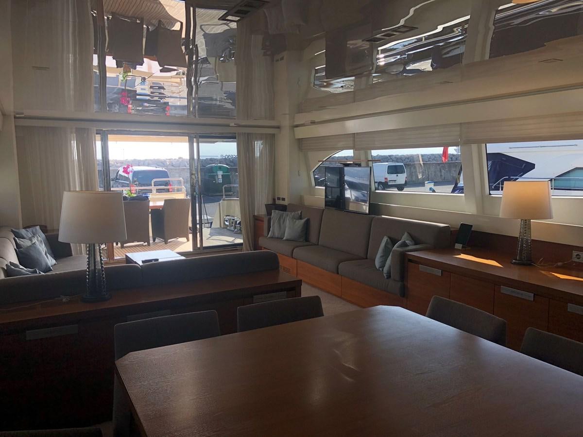 a room with a table and chairs aboard OCEAN DELTA 11 Yacht for Sale