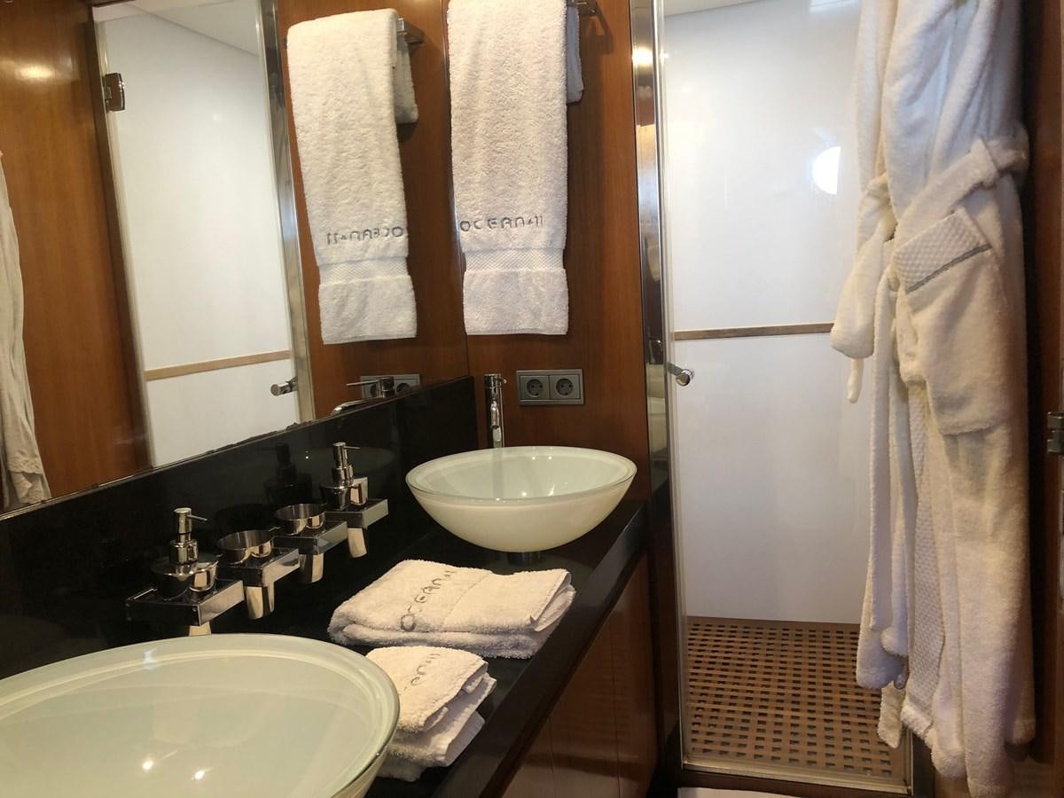 a bathroom with a sink and a mirror aboard OCEAN DELTA 11 Yacht for Sale