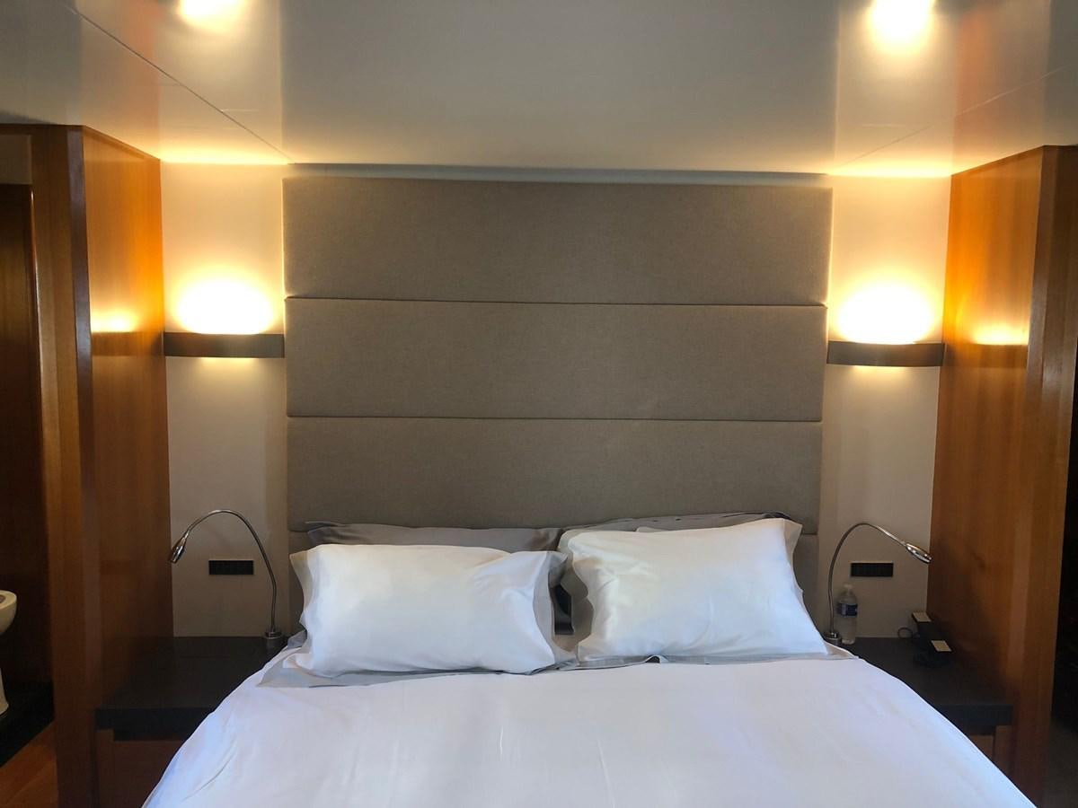 a bed with white sheets aboard OCEAN DELTA 11 Yacht for Sale