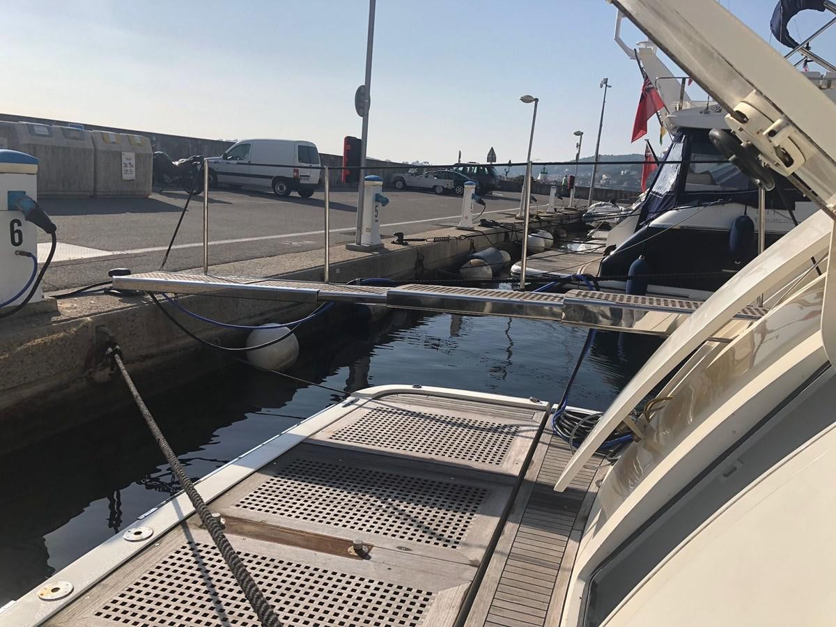 a boat is parked in a parking lot aboard OCEAN DELTA 11 Yacht for Sale