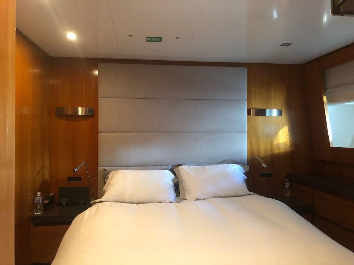 a bed with white sheets aboard OCEAN DELTA 11 Yacht for Sale