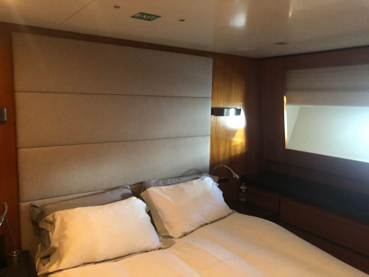 a bed with white sheets aboard OCEAN DELTA 11 Yacht for Sale