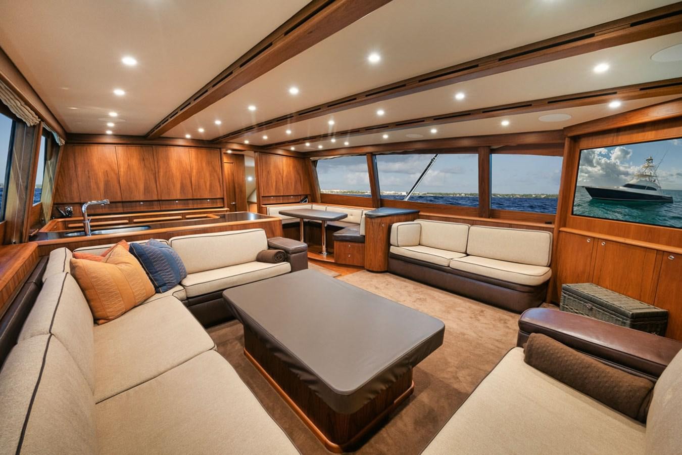 a living room with a large window aboard OWL'S NEST Yacht for Sale