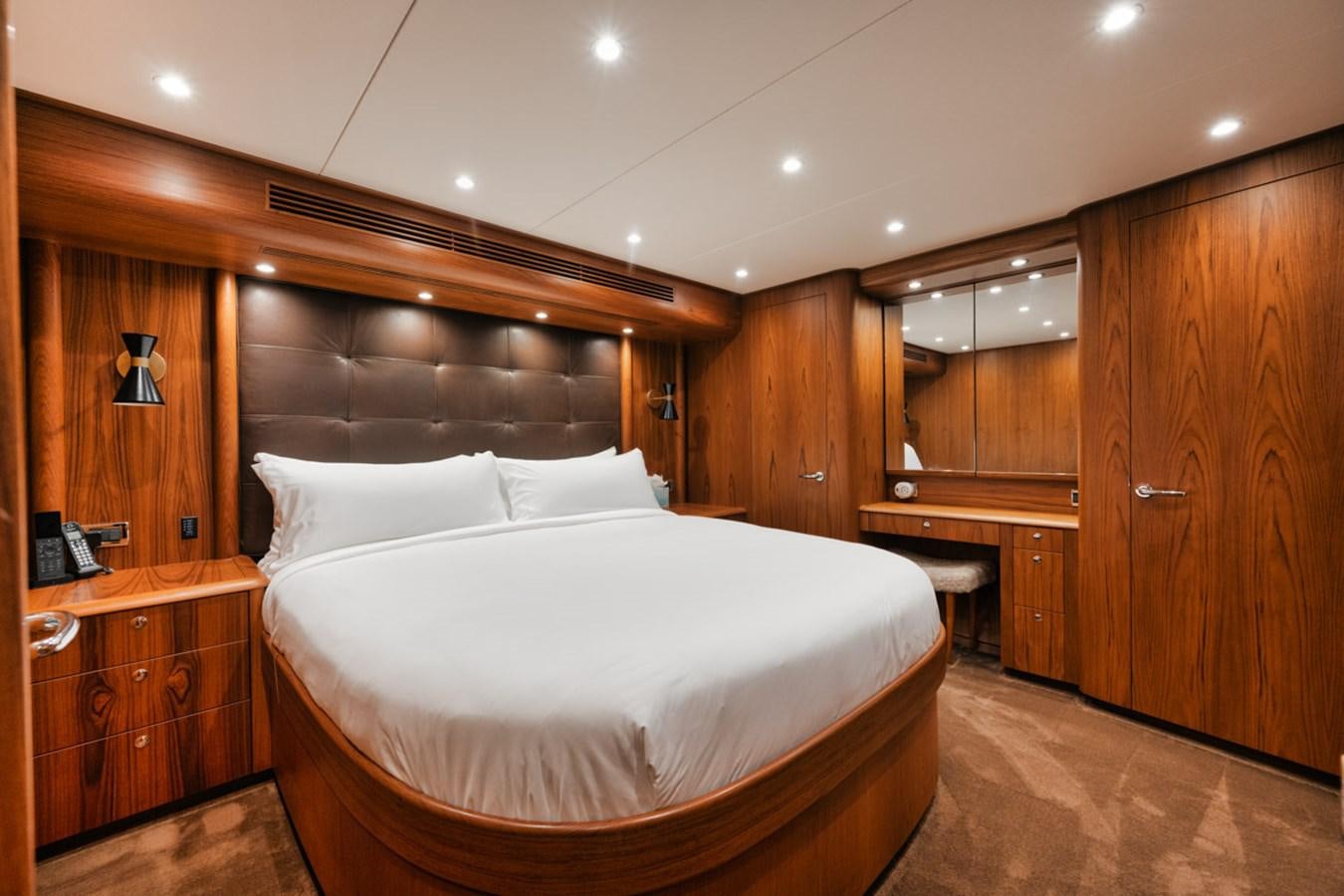 a bed in a wooden room aboard OWL'S NEST Yacht for Sale