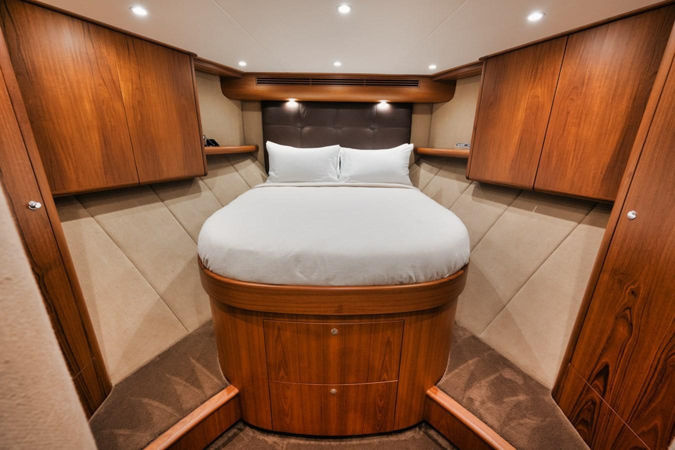 a bed in a room aboard OWL'S NEST Yacht for Sale
