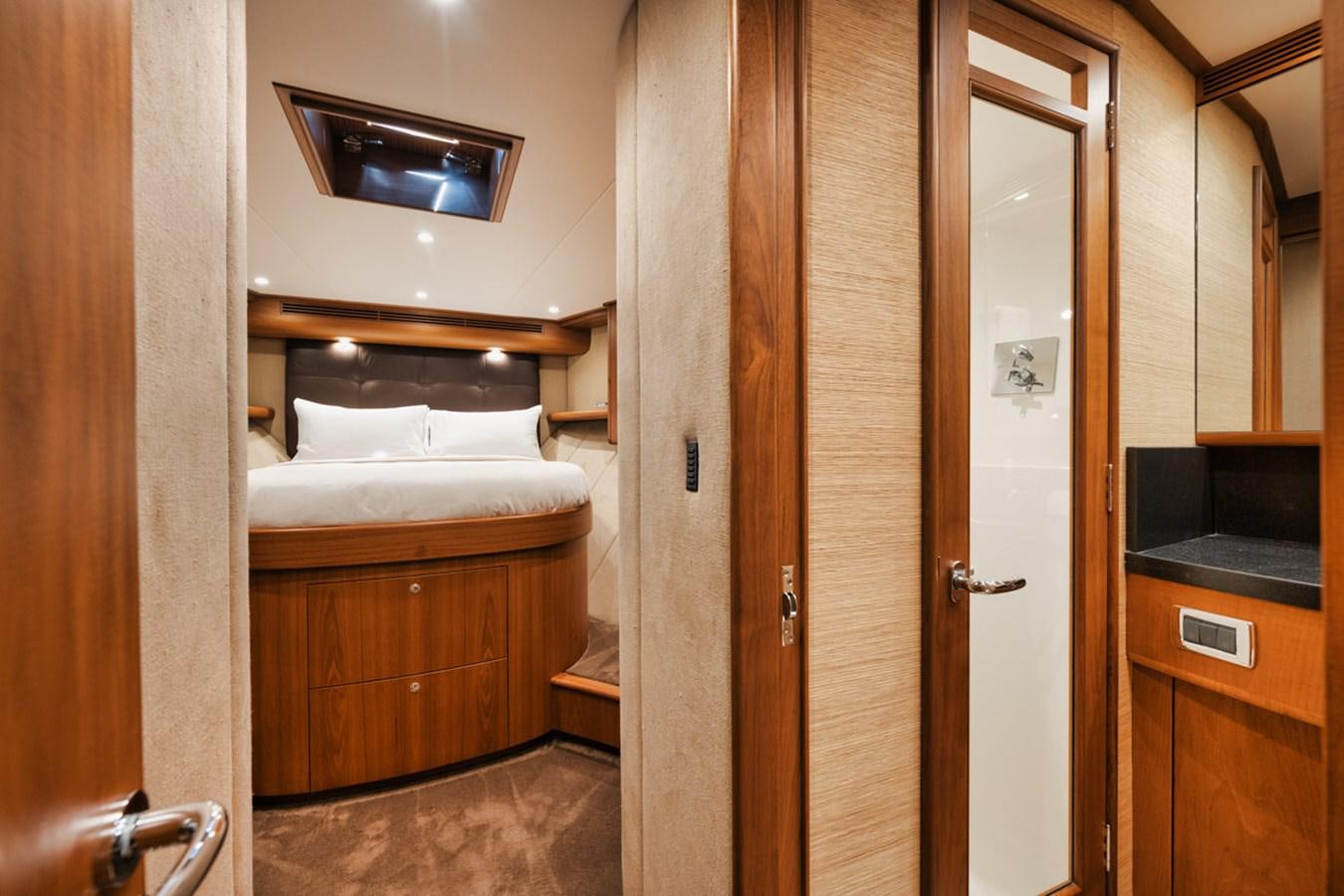 a room with a bed and a closet aboard OWL'S NEST Yacht for Sale