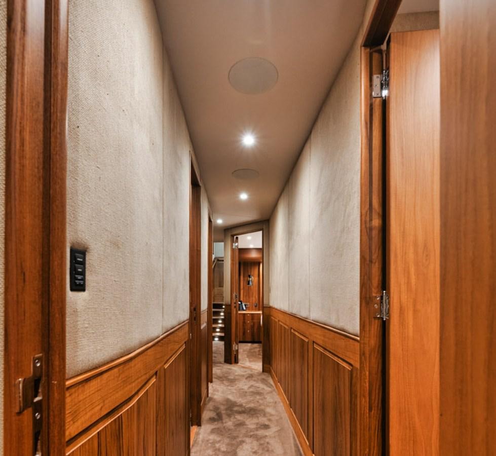 a hallway with wood cabinets aboard OWL'S NEST Yacht for Sale