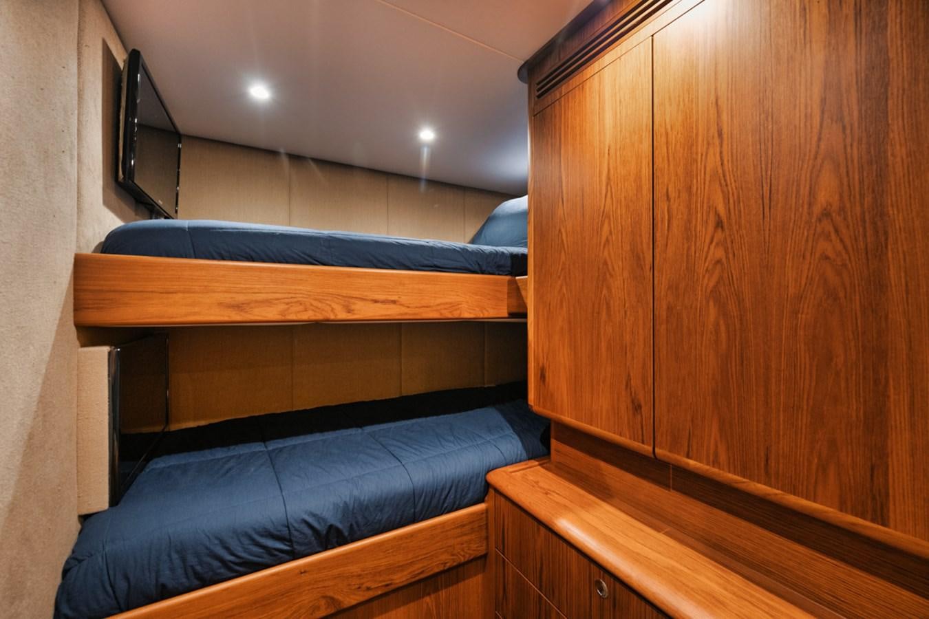 a bed in a room aboard OWL'S NEST Yacht for Sale