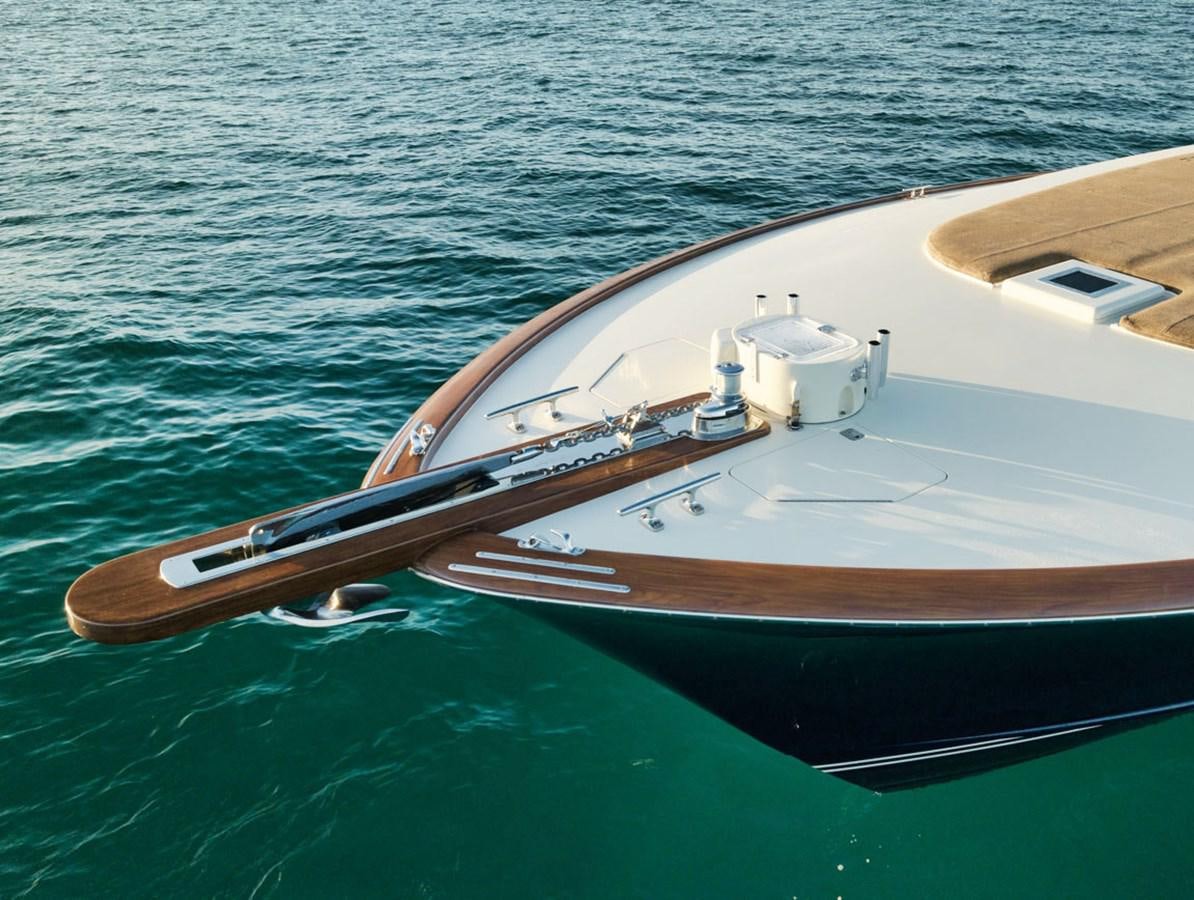 a wooden boat on the water aboard OWL'S NEST Yacht for Sale