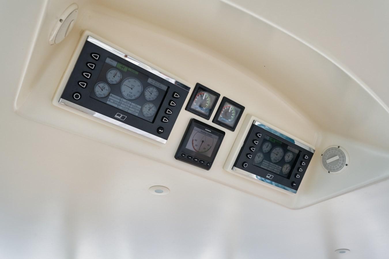a group of cell phones on a white surface aboard OWL'S NEST Yacht for Sale