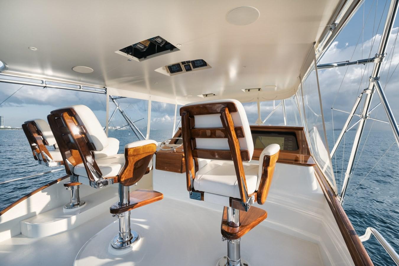 a boat with chairs on it aboard OWL'S NEST Yacht for Sale