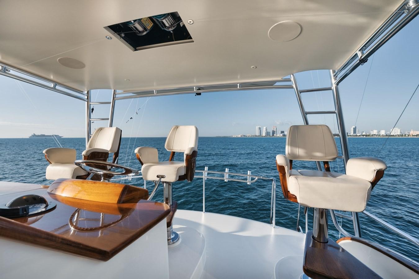 a boat with chairs on the deck aboard OWL'S NEST Yacht for Sale