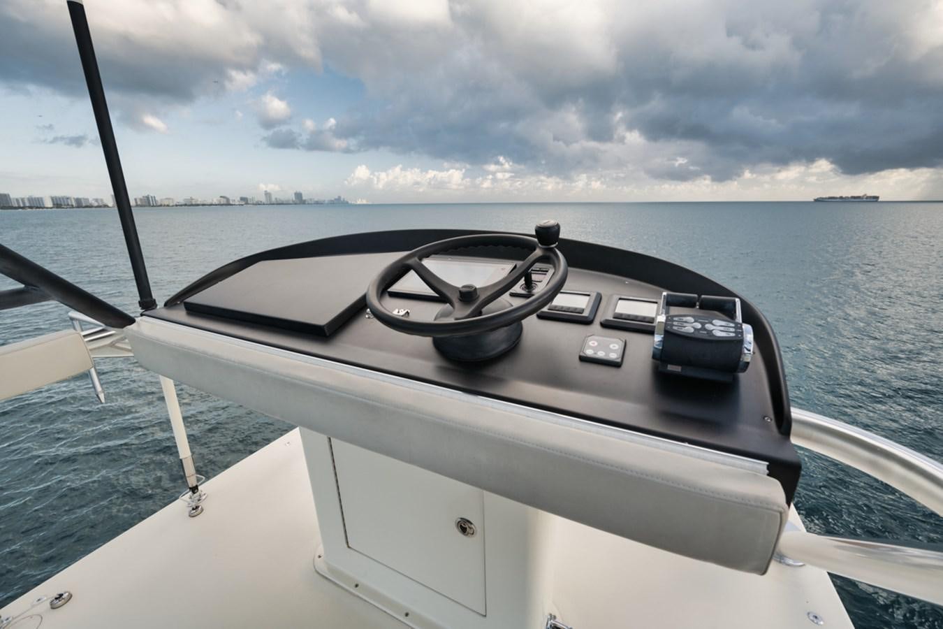 a steering wheel on a boat aboard OWL'S NEST Yacht for Sale